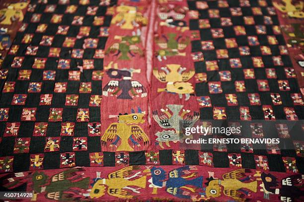 Archaeological textile pieces repatriated from Gothenburg, Sweden are displayed at the Antropology Museum in Lima on June 16, 2014. The Peruvian...