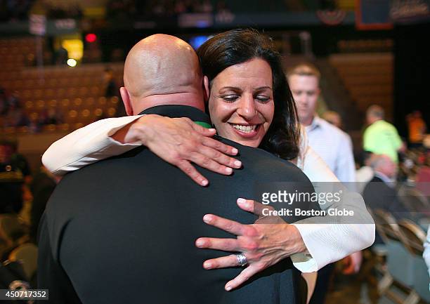 Juliette Kayyem hugs a delegate on the floor of the Democrat State Convention at the DCU Center in Worcester, Mass.