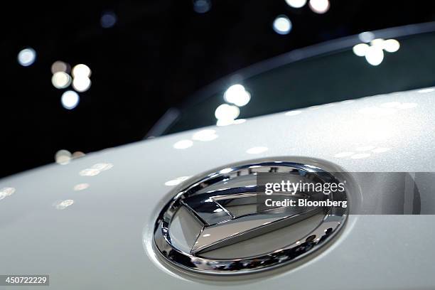 The Daihatsu Motor Co. Logo is seen on the front of a vehicle displayed at the 43rd Tokyo Motor Show 2013 in Tokyo, Japan, on Wednesday, Nov. 20,...