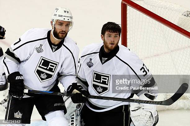 Jonathan Quick of the Los Angeles Kings looks on helmetless after a play at the net against the New York Rangers during the third period of Game...