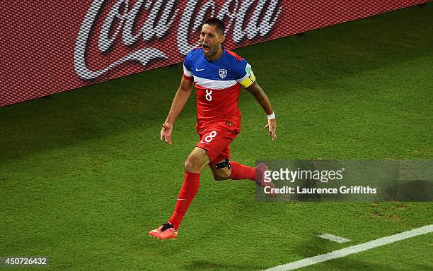 Clint Dempsey of the United States celebrates after scoring his team's first goal during the 2014 FIFA World Cup Brazil Group G match between Ghana...