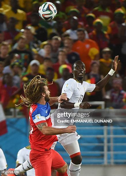 Midfielder Kyle Beckerman vies with Ghana's midfielder Mohammed Rabiu during a Group G football match between Ghana and US at the Dunas Arena in...