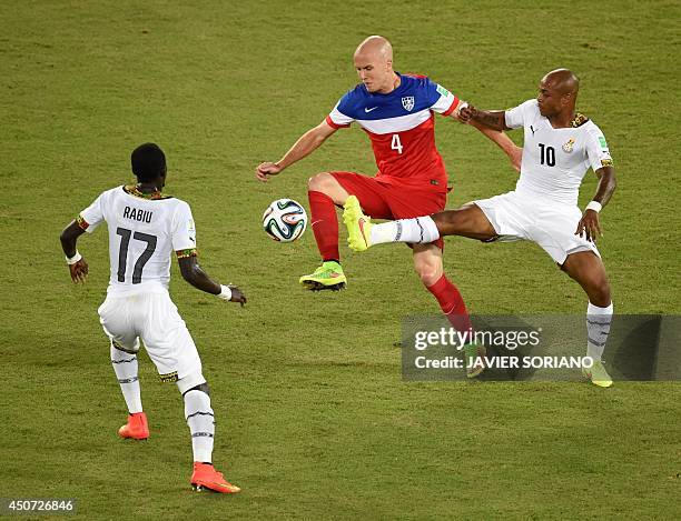 Ghana's midfielder Mohammed Rabiu and Ghana's midfielder Andre Ayew vie with US midfielder Michael Bradley during a Group G football match between...