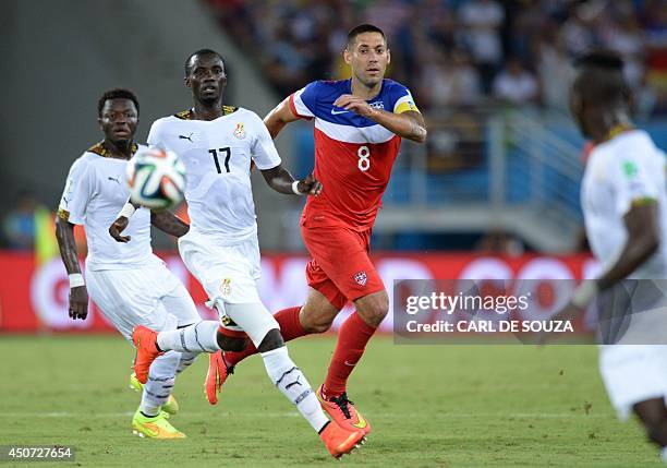 Ghana's midfielder Mohammed Rabiu and US forward Clint Dempsey eye the ball during a Group G football match between Ghana and US at the Dunas Arena...