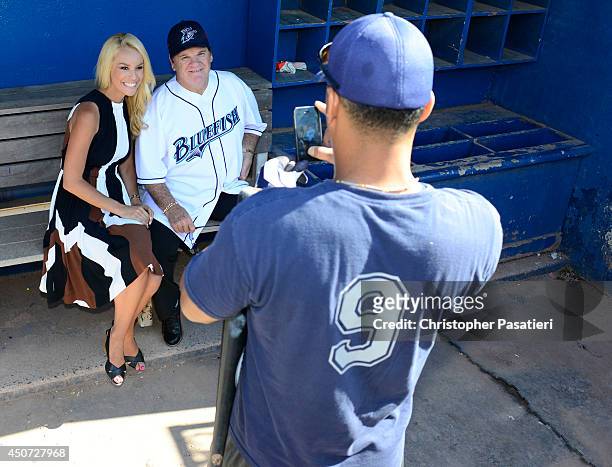 Former Major League Baseball player Pete Rose poses for a photo with ESPN reporter Britt McHenry after an interview prior to managing the game for...