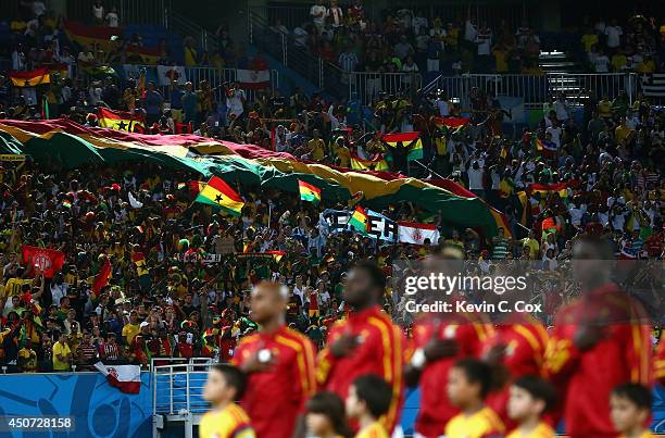 Ghana players line up on the field as fans cheer before the 2014 FIFA World Cup Brazil Group G match between Ghana and the United States at Estadio...