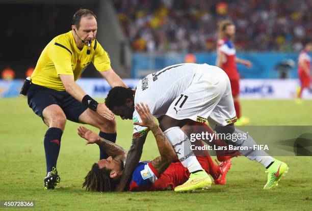 Jermaine Jones of the United States confronts Sulley Muntari of Ghana during the 2014 FIFA World Cup Brazil Group G match between Ghana and USA at...