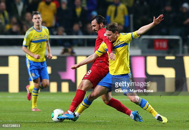 Kim Kaellstroem of Sweden battles for the ball with Hugo Almeida of Portugal during the FIFA 2014 World Cup Qualifier Play-off Second Leg match...