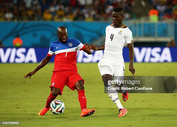 DaMarcus Beasley of the United States is challenged by Daniel Opare of Ghana during the 2014 FIFA World Cup Brazil Group G match between Ghana and...