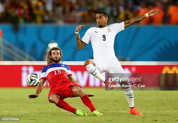 Kyle Beckerman of the United States tackles Kevin-Prince Boateng of Ghana during the 2014 FIFA World Cup Brazil Group G match between Ghana and the...
