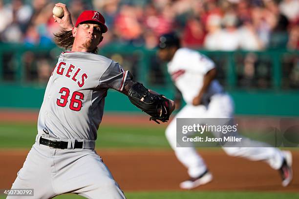 Starting pitcher Jered Weaver of the Los Angeles Angels of Anaheim pitches as Michael Bourn of the Cleveland Indians breaks for second base during...
