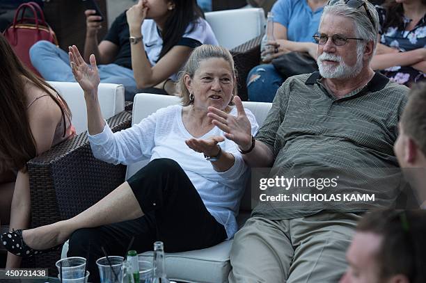 People react after Ghana scored the equalizer against the US in the 2014 FIFA World Cup at an outdoor bar in Washington on June 16, 2014. The US went...