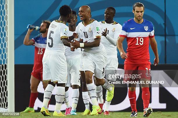 Ghana's midfielder Andre Ayew celebrates with Ghana's midfielder Michael Essien after scoring during a Group G football match between Ghana and US at...