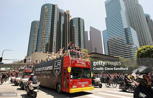 Members of the Los Angeles Kings ride on buses through downtown Los Angeles during the 2014 LA Kings Stanley Cup Championship Parade and Rally on...