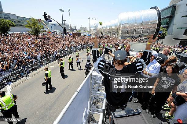 Anze Kopitar of the Los Angeles Kings shows the Stanley Cup Trophy to the crowd during the Los Angeles Kings victory parade and rally on June 16,...