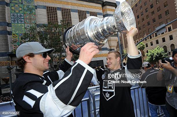 Anze Kopitar and Dustin Brown of the Los Angeles Kings celebrate with the Stanley Cup Trophy during the Los Angeles Kings victory parade and rally on...