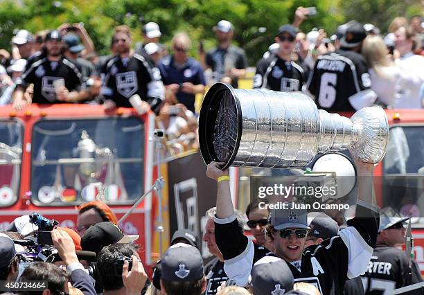 Anze Kopitar of the Los Angeles Kings holds up the Stanley Cup during the Los Angeles Kings Championship Parade on June 16, 2014 in Los Angeles,...