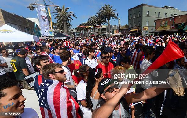 Jimmy Romero blows his vuvuzela as US soccer fans took to the pier at Hermosa Beach, California on June 16 to follow the action between the United...