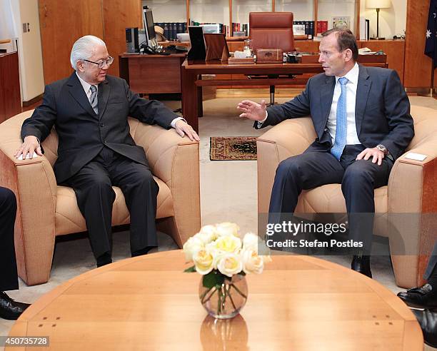 Australian Prime Minister Tony Abbott and Singapore President Tony Tan Keng Yam talk inside the Prime Ministers office at Parliament House on June...