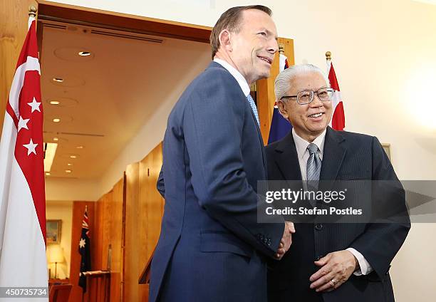 Australian Prime Minister Tony Abbott and Singapore President Tony Tan Keng Yam pose for the media at Parliament House on June 17, 2014 in Canberra,...