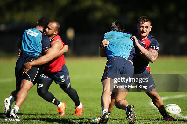 Jared Waerea-Hargreaves of the Roosters wrestles with Jacques Potgieter of the Waratahs during a joint training session between the Waratahs and the...