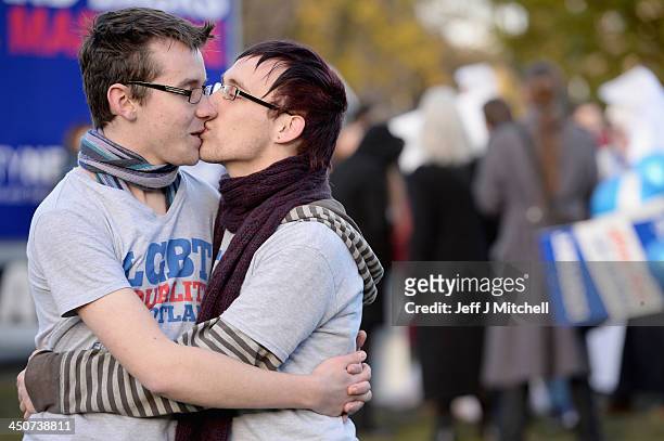 Mark Lerra and Connor Finlayson kiss as they join campaigners from the Equality Network holding a rally outside the Scottish Parliament on November...