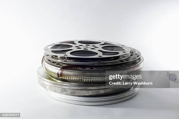 stack of film reels in canisters - film set stockfoto's en -beelden