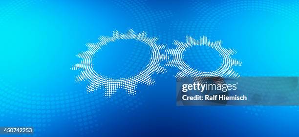 two cogs against a blue background - two objects stock illustrations