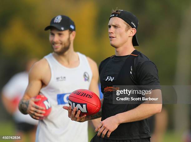 Brent Macaffer and Dayne Beams of the Magpies look on during a Collingwood Magpies AFL training session on June 17, 2014 in Melbourne, Australia.