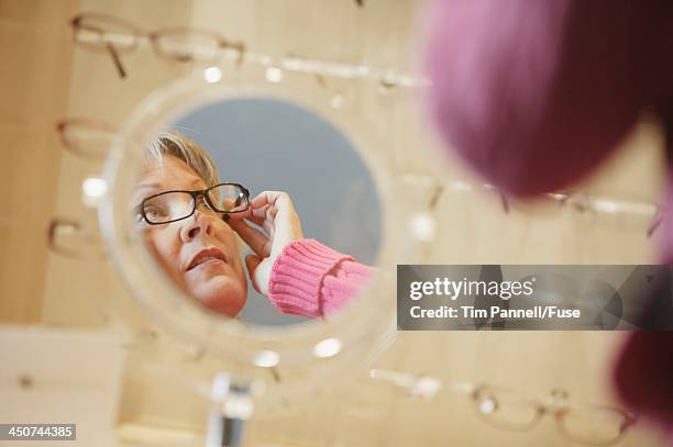 Look Over Spectacles Older Woman Looking Over Glasses Photos and Premium High Res Pictures ...