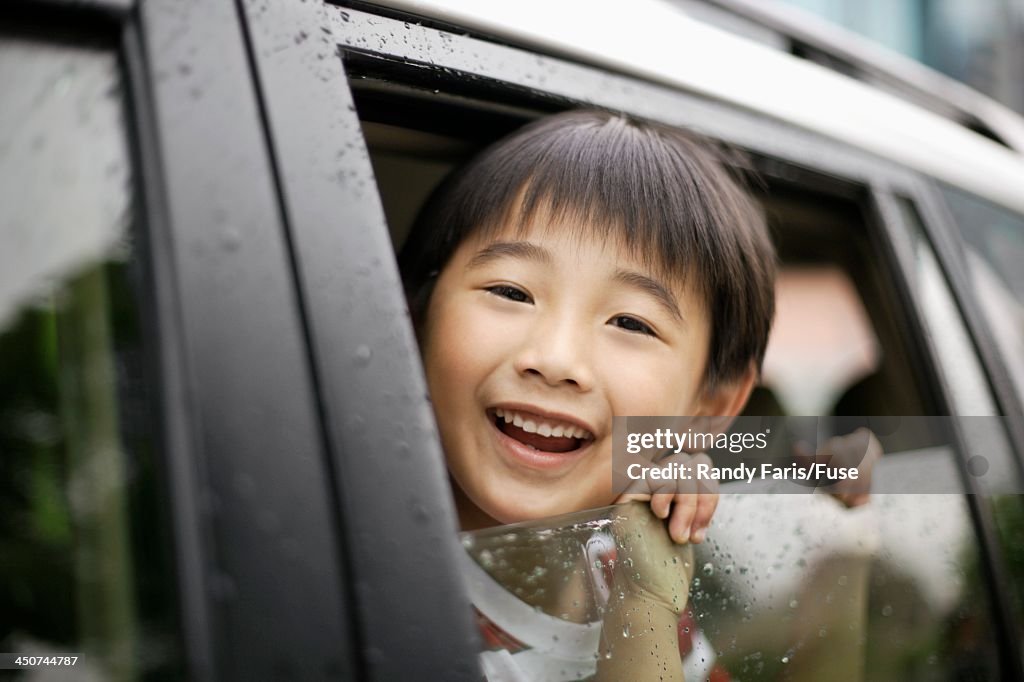 Child Looking Out of Automobile Window