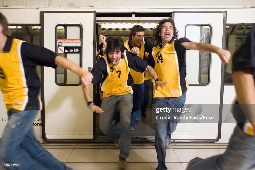 Excited Sports Fans Leaving Subway