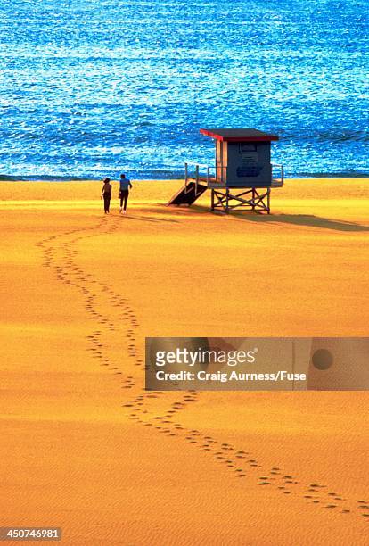 couple running across a beach - digital enhancement stock pictures, royalty-free photos & images