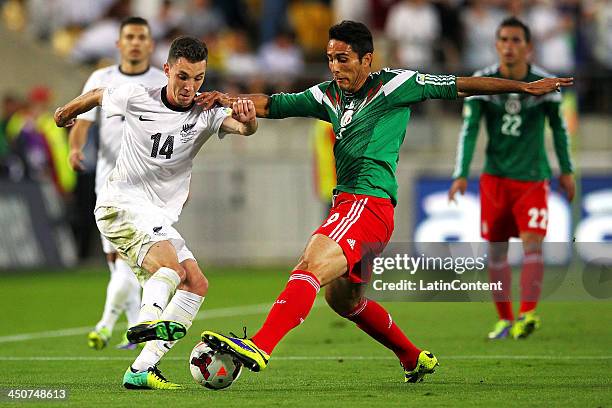 Aldo De Nigris Guajardo of Mexico competes against Storm Roux of New Zealand during leg 2 of the FIFA World Cup Qualifier match between the New...