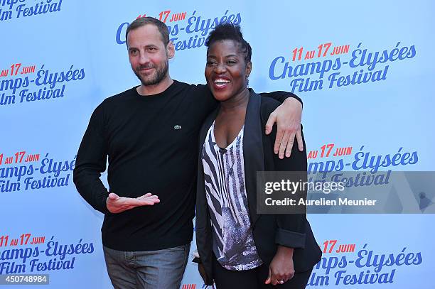 Fred Testot and Claudia Tagbo attend the Bon Retablissement! Paris Premiere during Day 6 of the Champs Elysees Film Festival on June 16, 2014 in...