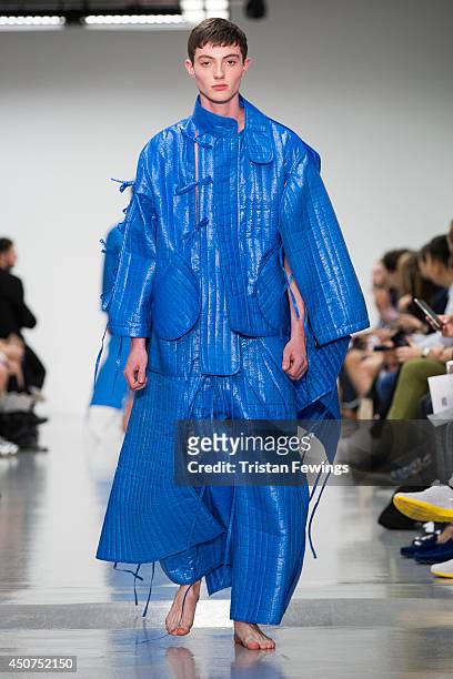 Model walks the runway at the Craig Green show during the London Collections: Men SS15 on June 17, 2014 in London, England.
