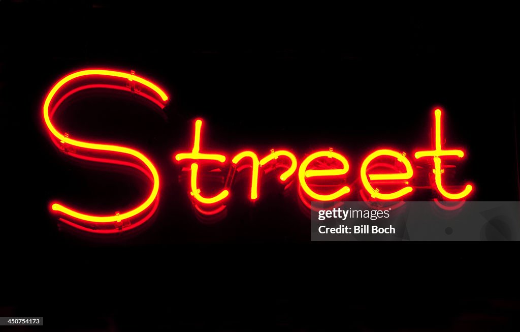 The word 'Street' in neon on a black background