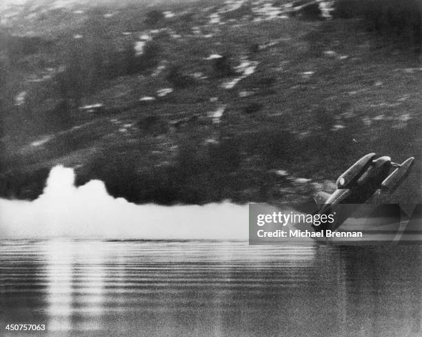 Donald Campbell's speed boat Bluebird K7 leaves the surface of Coniston Water in the Lake District, before crashing during an attempt on the world...