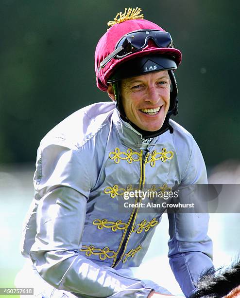 Jockey Richard Hughes celebrates after riding Toronado to win the Queen Anne Stakes during day one of Royal Ascot at Ascot Racecourse on June 17,...