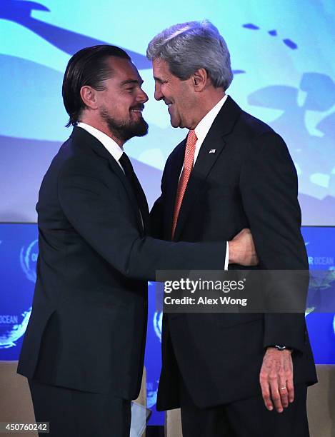 Secretary of State John Kerry greets actor Leonardo DiCaprio during the second and the final day of the "Our Ocean" conference June 17, 2014 at the...