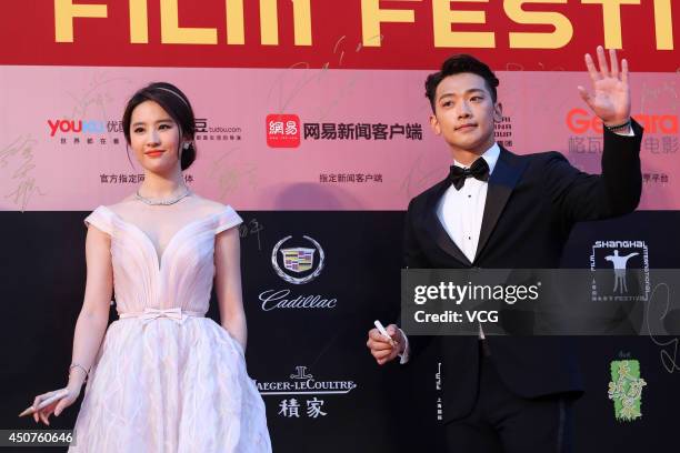 Actress Liu Yifei and South Korea singer and actor Rain walk the red carpet at the 17th Shanghai International Film Festival on June 14, 2014 in...