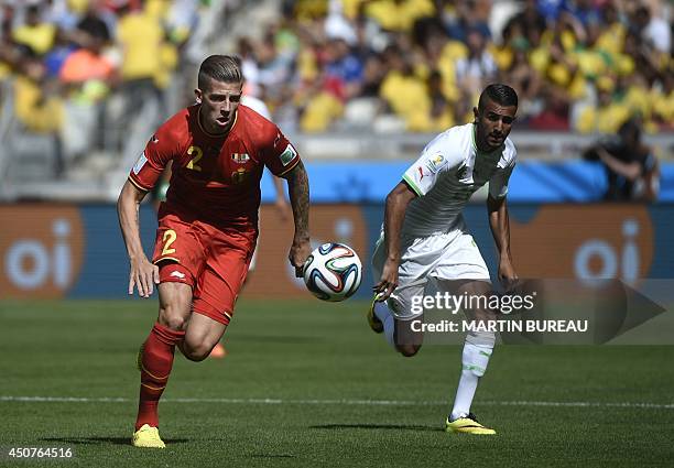 Belgium's defender Toby Alderweireld and Algeria's forward Riyad Mahrez vie for the ball during a Group H football match between Belgium and Algeria...