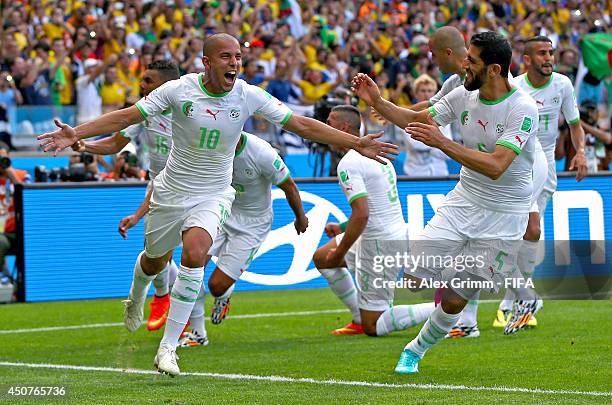 Sofiane Feghouli of Algeria celebrates after scoring the team's first goal from the penalty spot during the 2014 FIFA World Cup Brazil Group H match...