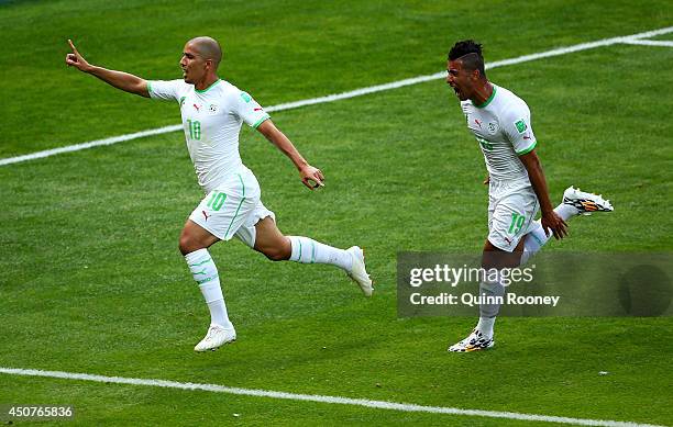 Sofiane Feghouli of Algeria and Saphir Taider celebrate their team's first goal after a penalty kick during the 2014 FIFA World Cup Brazil Group H...