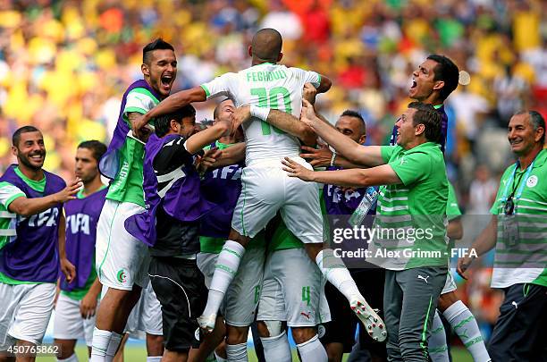 Sofiane Feghouli of Algeria celebrates after scoring the team's first goal from the penalty spot during the 2014 FIFA World Cup Brazil Group H match...