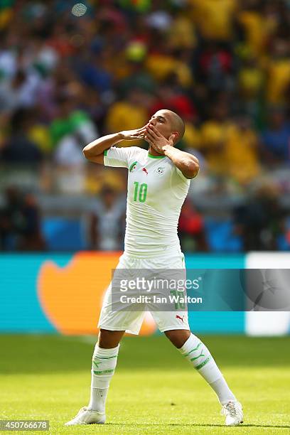 Sofiane Feghouli of Algeria celebrates scoring his team's first goal on a penalty kick during the 2014 FIFA World Cup Brazil Group H match between...