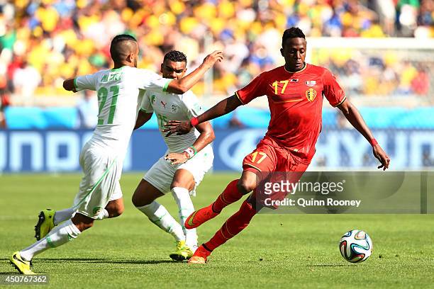 Divock Origi of Belgium controls the ball against Riyad Mahrez of Algeria during the 2014 FIFA World Cup Brazil Group H match between Belgium and...
