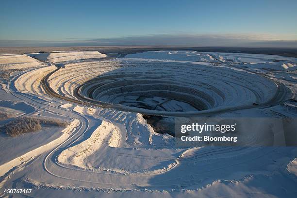 Snow covers the open pit of the Nyurbinsky diamond mine operated by OAO Alrosa in Nakyn, Russia, on Friday, Nov. 15, 2013. OAO Alrosa, the world's...