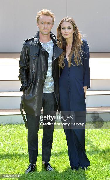 Tom Felton and Jade Olivia attend the Burberry Prorsum show during the London Collections: Men SS15 on June 17, 2014 in London, England.