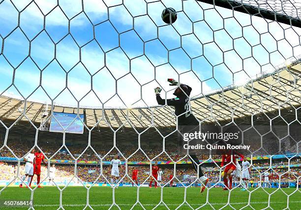 Marouane Fellaini of Belgium scores his team's first goal on a header past Rais M'Bolhi of Algeria during the 2014 FIFA World Cup Brazil Group H...